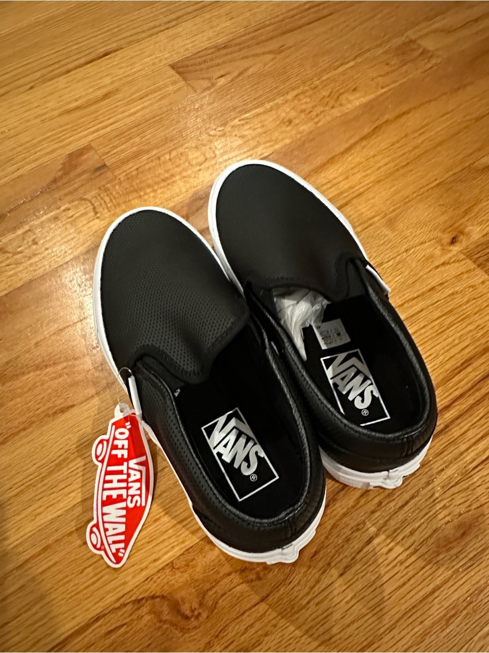Vans Unisex Classic Slip-On Sneakers in Black and White